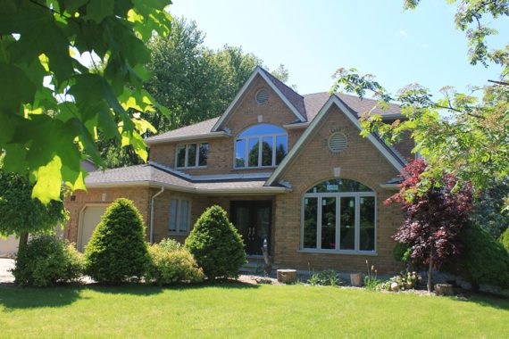 Project Gallery: Oversized Windows with Transoms (exterior view) Oversized windows with transoms installed by Heritage Renovations in London, Ontario, and manufactured by Gentek and North Star Windows & Doors.