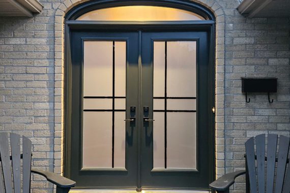 Black-Steel-Double-Entry-Door A black steel double door with curved transom from Gentek Entryguard.
