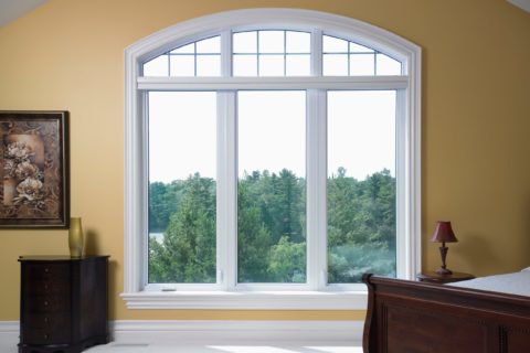 White Casement Window with Transom and Grilles A white casement window with transom and grilles from Heritage Renovations.